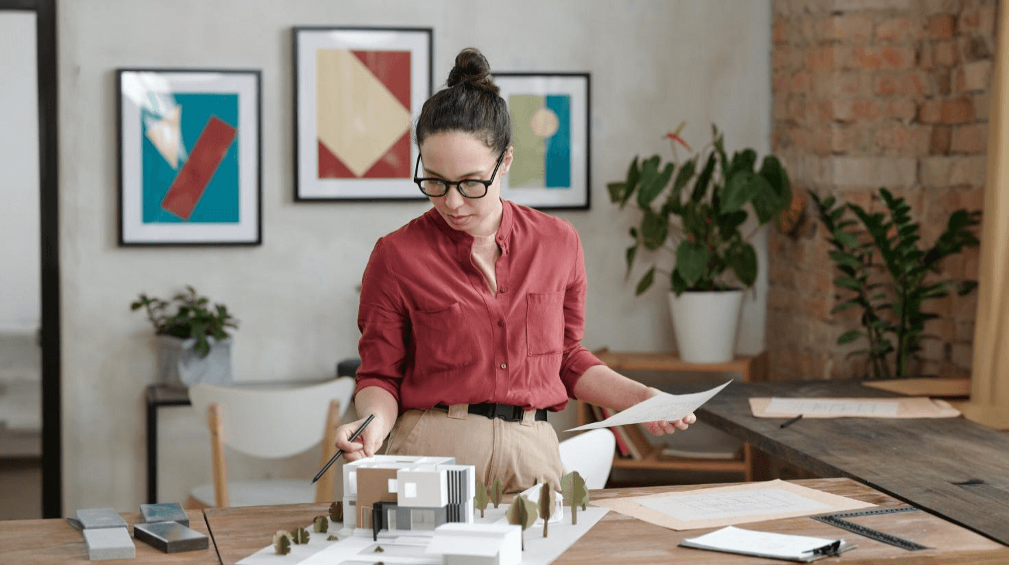 Person reviewing financial reports and valuation data for an interior design business